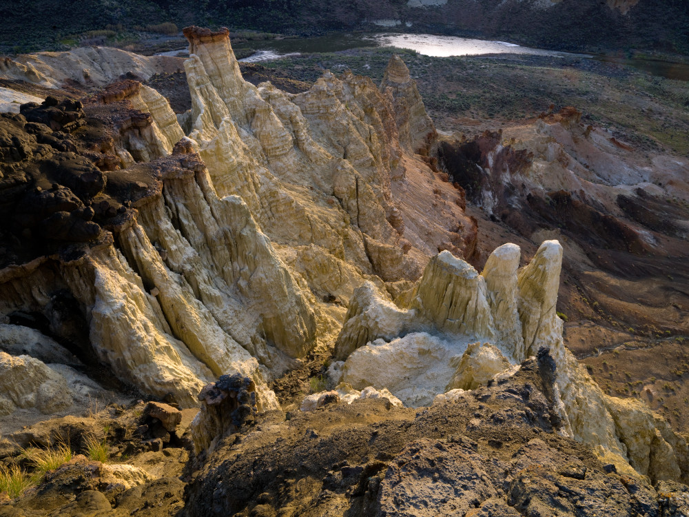 The Owyhee River flows past the hoodoos of Pruett's Castle deep in the Owyhee  Canyonlands, Oregon.