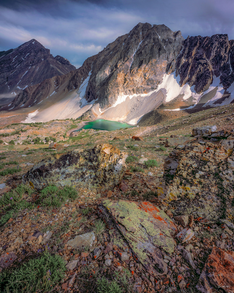 The sun highlights patches of Leatherman Peak above Pass Lake in the Lost River Mountain Range, Idaho.