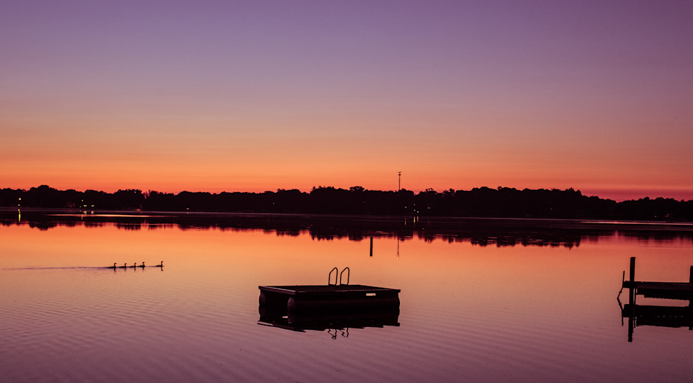 Lake at Sunrise with ducks and swimming platform
