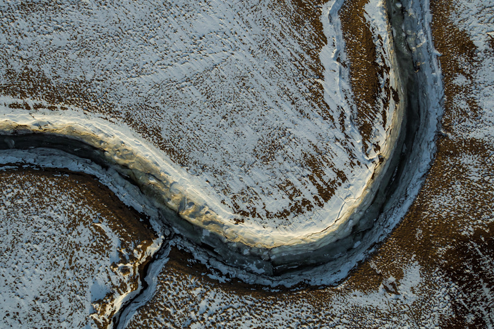 Aerial photo of a curved river eroded by glacial waters in Iceland