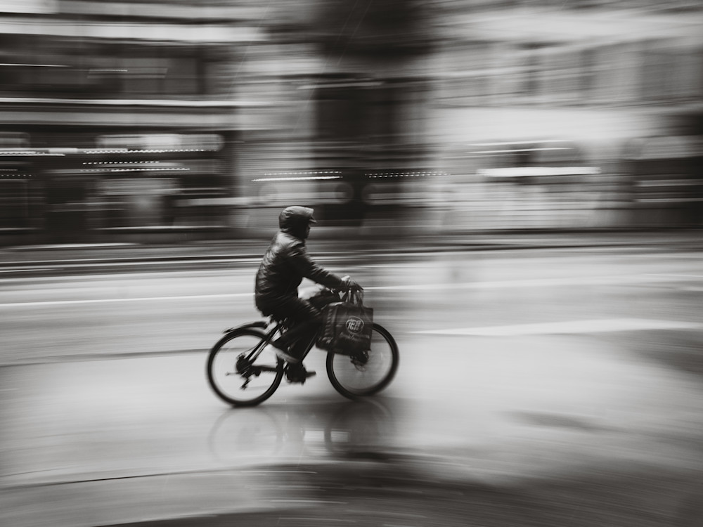 Velocity in the Rain – Panning Cyclist Street Photography by Luis R.R. Siqueira