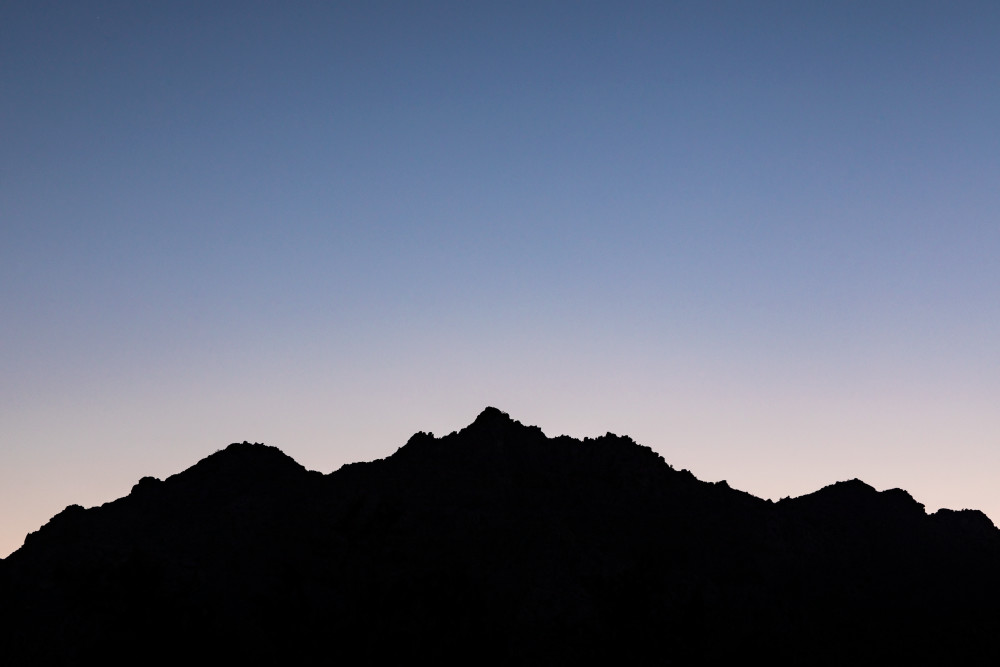 Silhouette of mountains in Joshua Tree National Park at Indian Cove entrance, California, USA.
