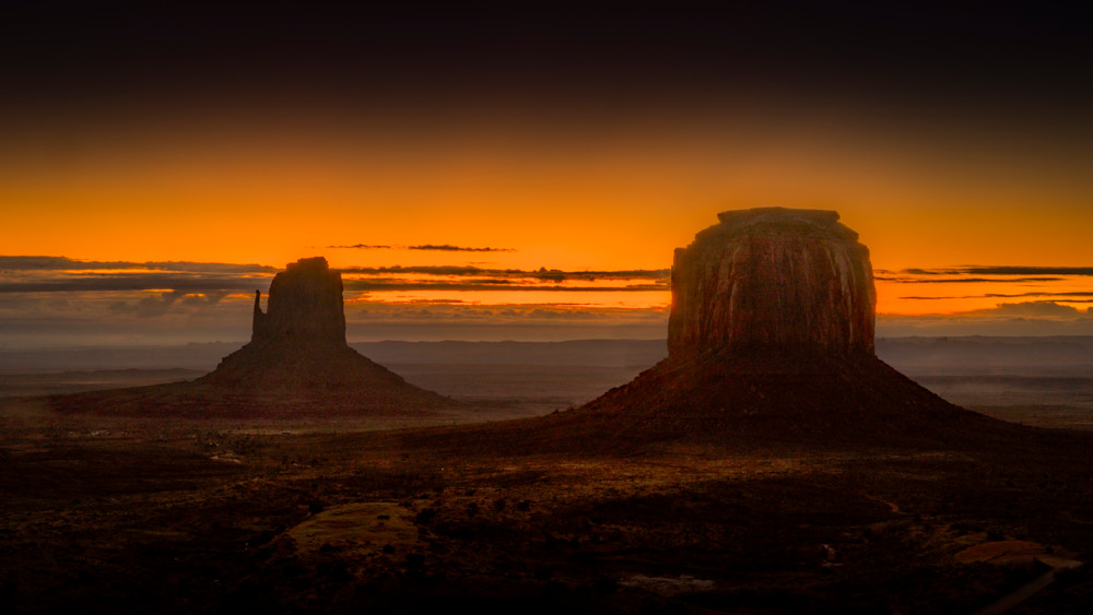 First Light at Sunrise with East Mitten and Merrick Butte in Monument Valley