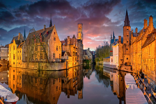 Bruges at dusk along canal belgium tewjlg