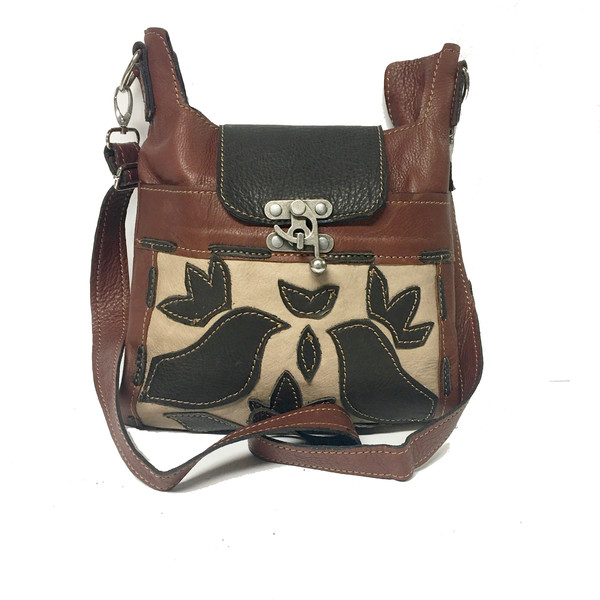 cross-body leather handbag with block print or cut art