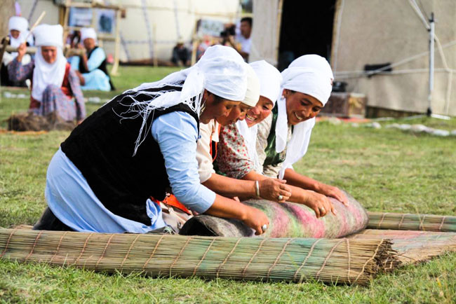 Village women felting a rug