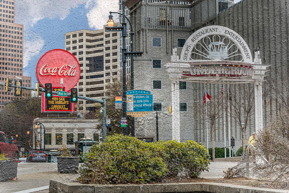 A photo of one of the Underground signs with the Coke sign in the background. A texture from the surrounding area was photographed and added to the photo