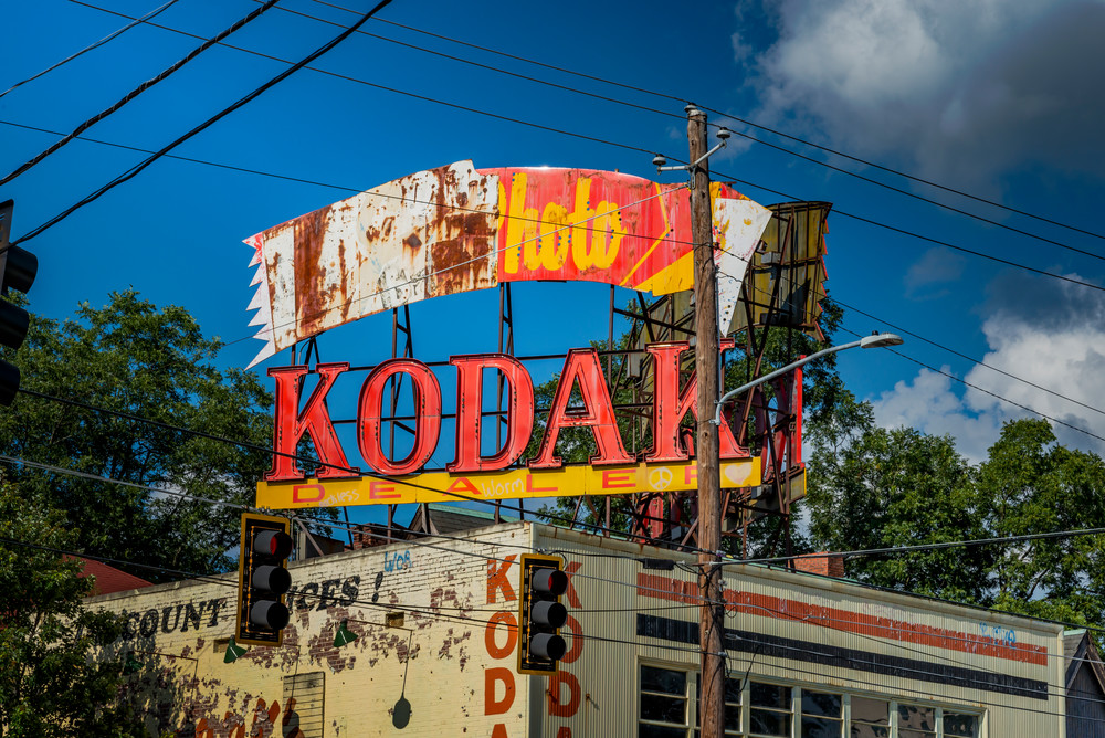 Wires and telephone poles surround the old Kodak sign on Ponce de Leon Ave.