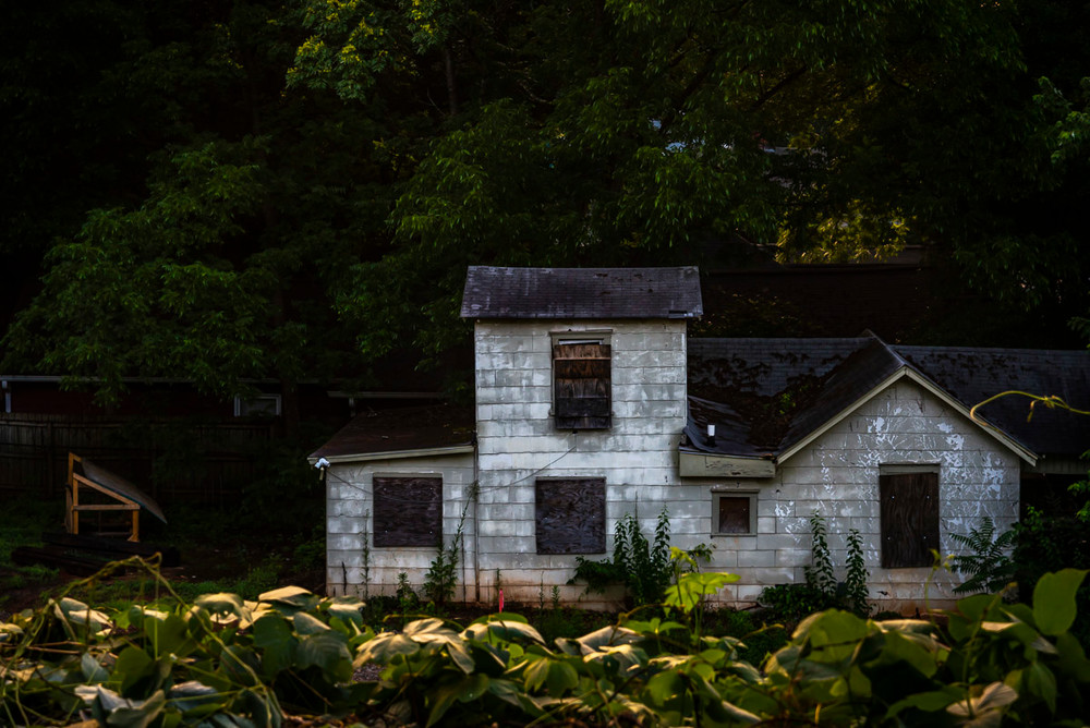 An old boarded-up house on the edge of the Beltline