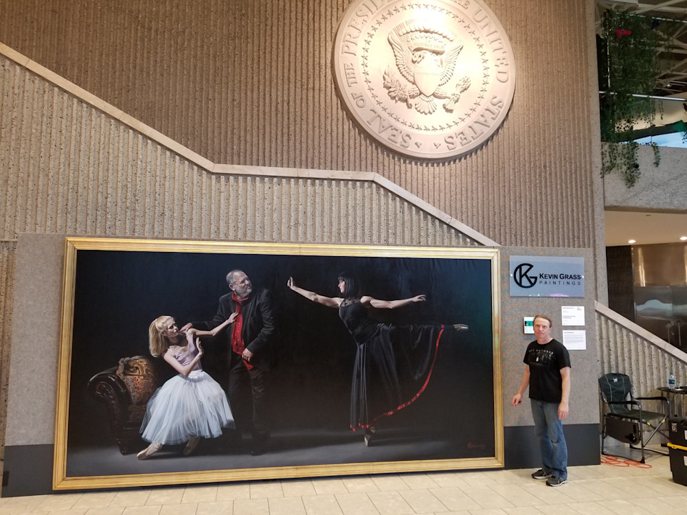Florida artist Kevin Grass with his large "Not #MeToo: No More Casting Couch" painting in the Gerald R. Ford Presidential Museum during ArtPrize 2018.