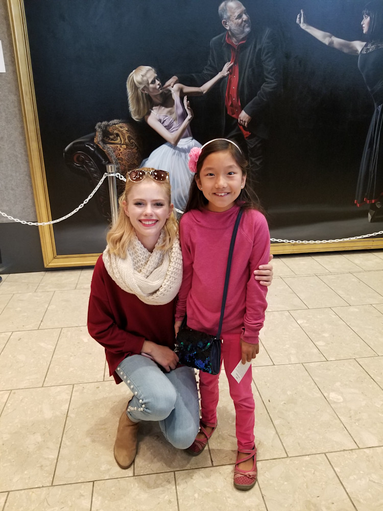 Alexandra Annas posing with an aspiring ballerina during ArtPrize in Grand Rapids