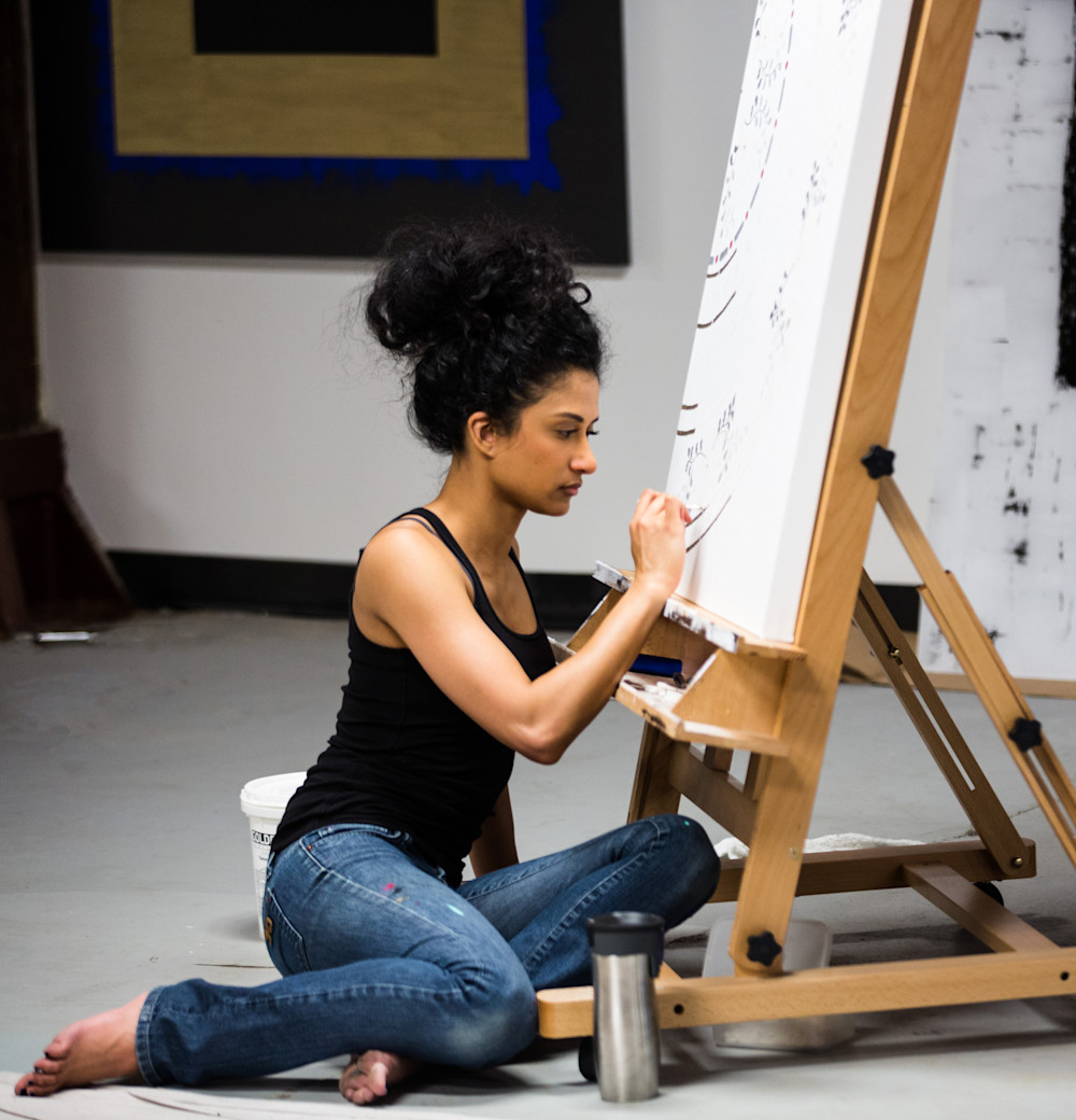 Natasha Kohli, painting in her studio