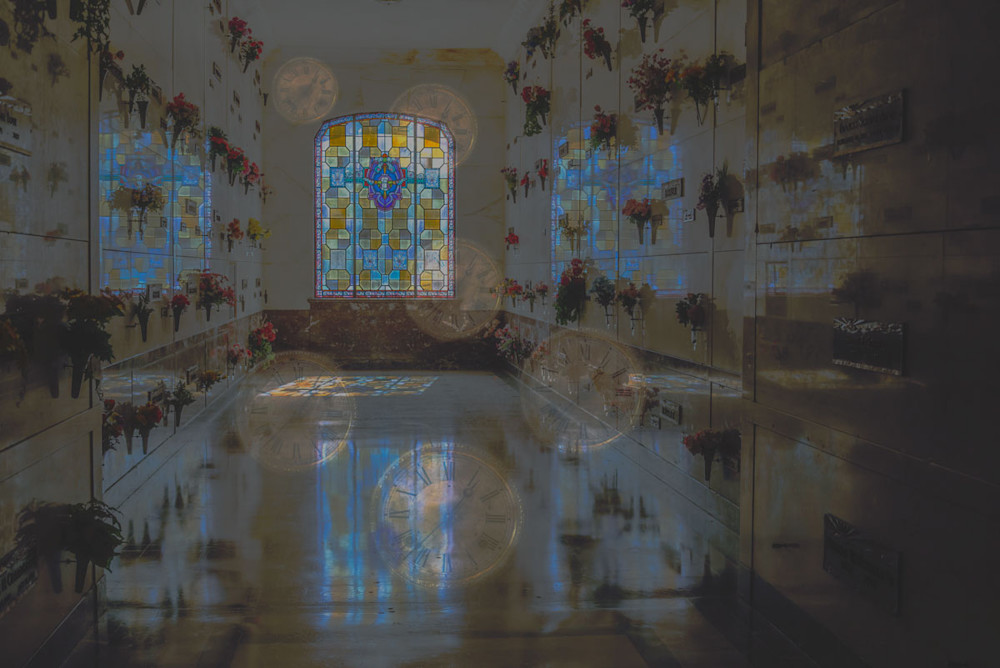 Transparent clocks floating in a mausoleum 