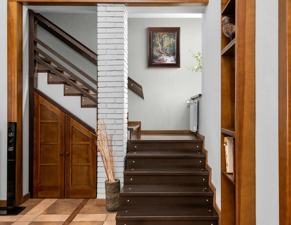Woods Lovely Dark Wooden staircase filled with natural light