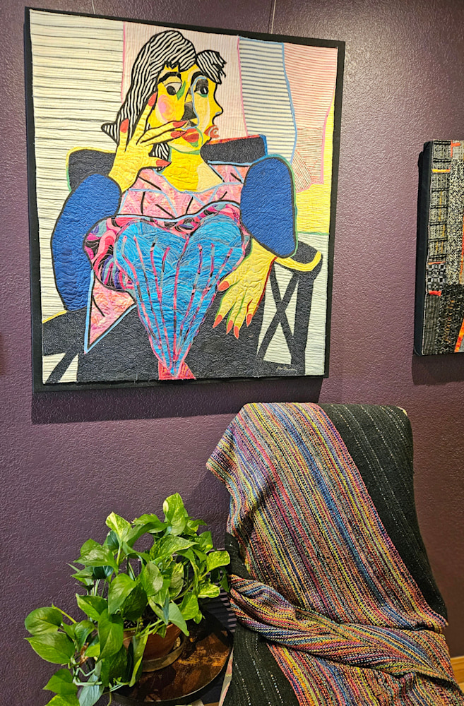 women Sitting in a Chair on the wall