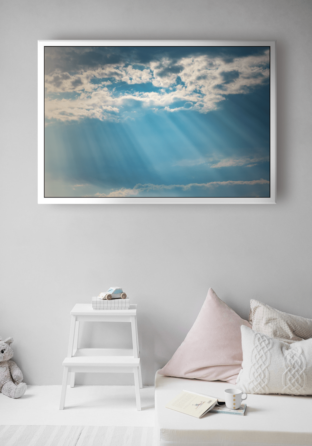 the final canvas image displaying a sunset sky hanging in a bedroom