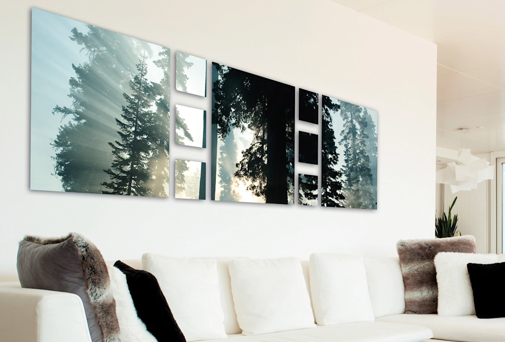 A grouping of gloss metal prints above a sofa.