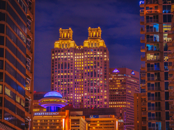 Hyatt Regency and 191 Peachtree Towers in downtown Atlanta at blue hour with a pretty blue sky and the lights on in the buildings