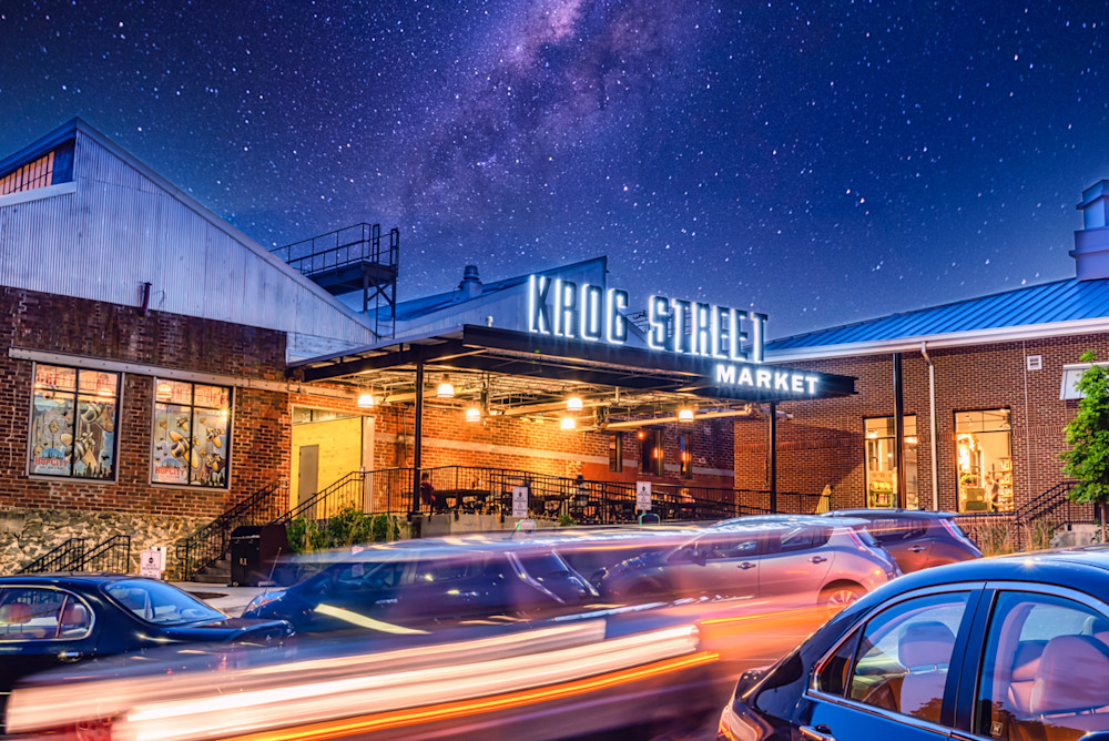 The Krog Street Market sign at night with light trails in the parking lot (foreground) and the Milky Way in the sky