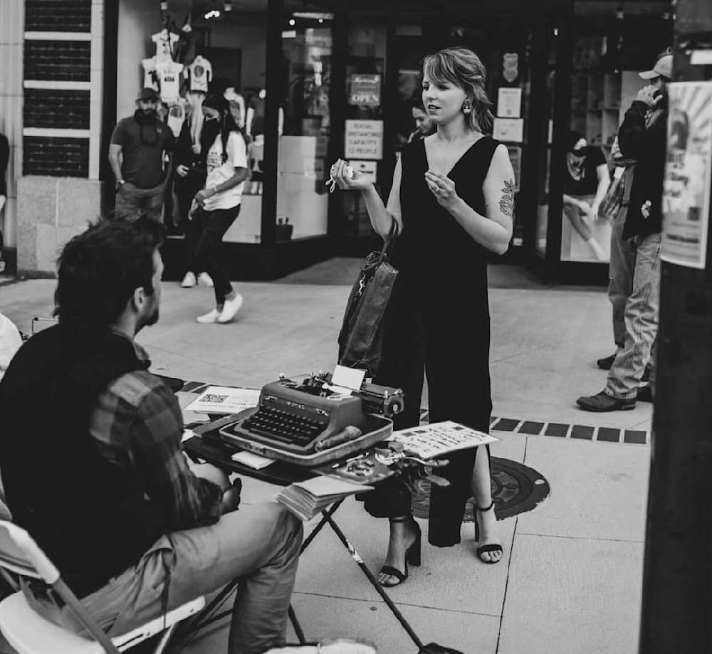 Jordan Carrissa with Street Poet Cary Gray in Asheville, North Carolina