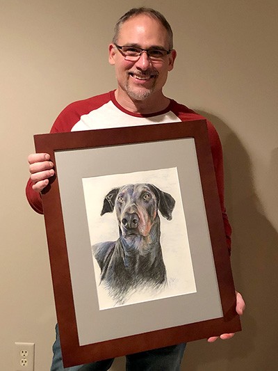 Dave, gifted a commissioned pastel pencil portrait of his Doberman, Sky