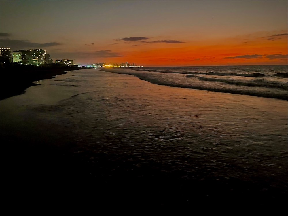 An Atlanta photographer on the beach in Cartagena, Colombia at dusk