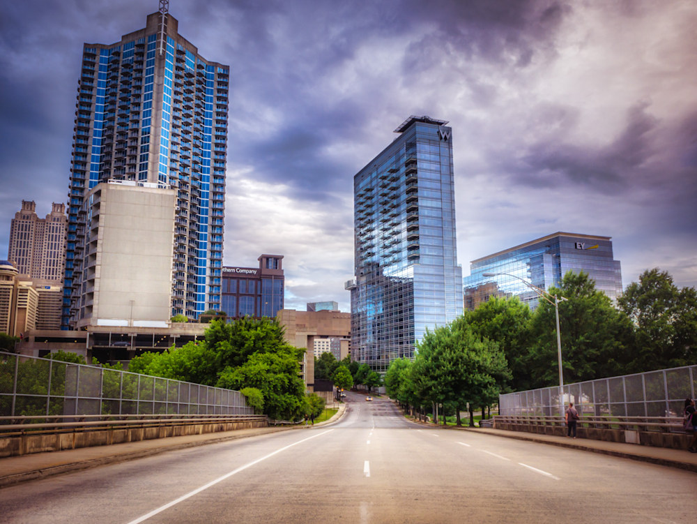 An Atlanta photographer photo of the middle of the road looking down a street toward some Atlanta buildings downtown