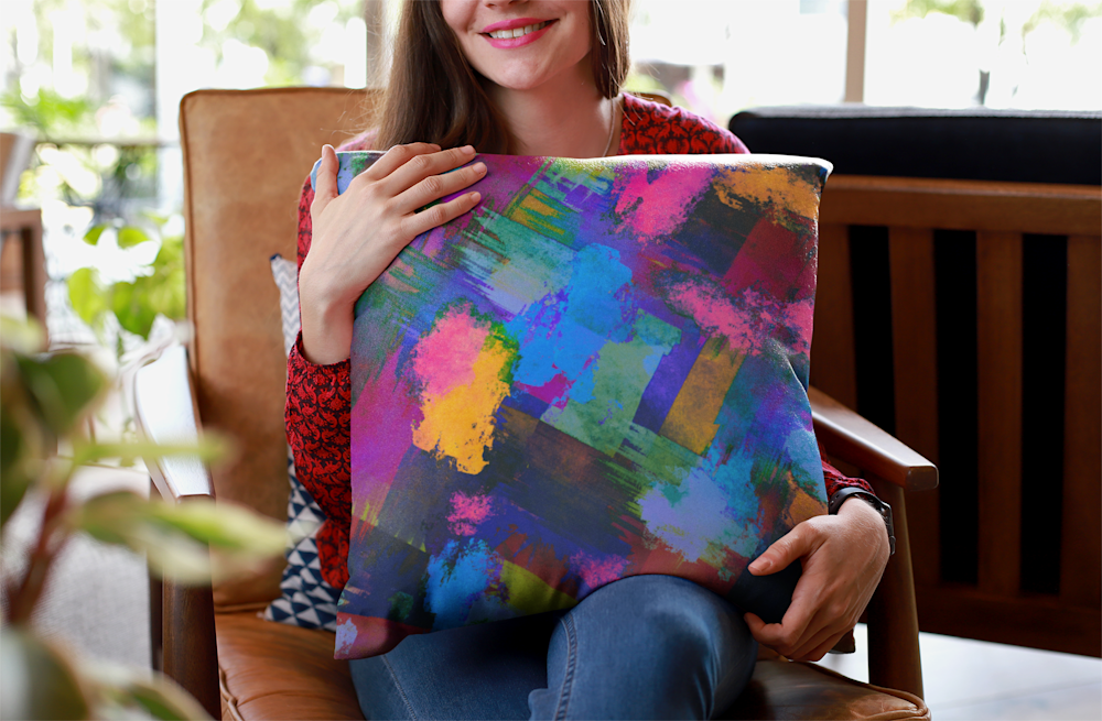 Women holding abstract throw pillow. ("Density")