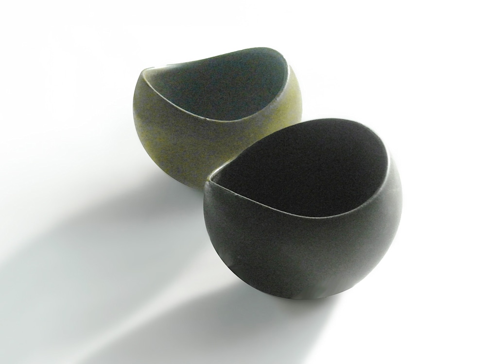 This bowl is shown in the fore ground with a brown sugar bowl cast at a later date in red stoneware