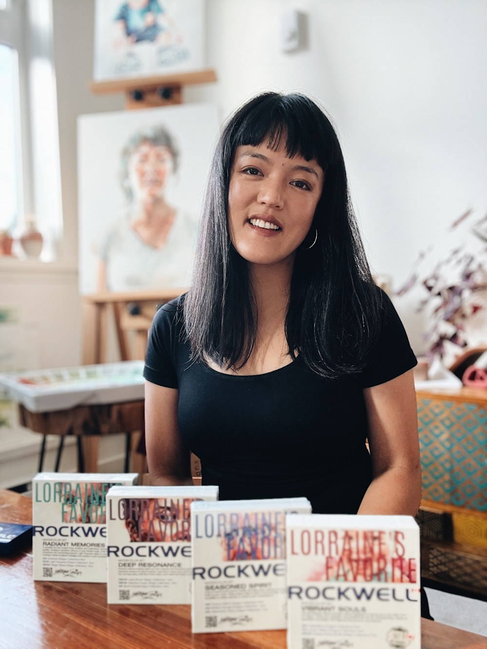 Lorraine Simonds, Watercolour Artist, Rockwell Arts Canada Ambassador, holding paintbrushes and Rockwell Art Paints