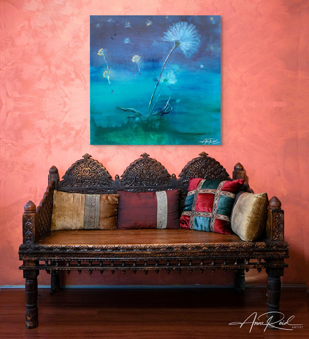 Dandelion-inspired blue artwork above carved bench with jewel-toned pillows in eclectic boho space