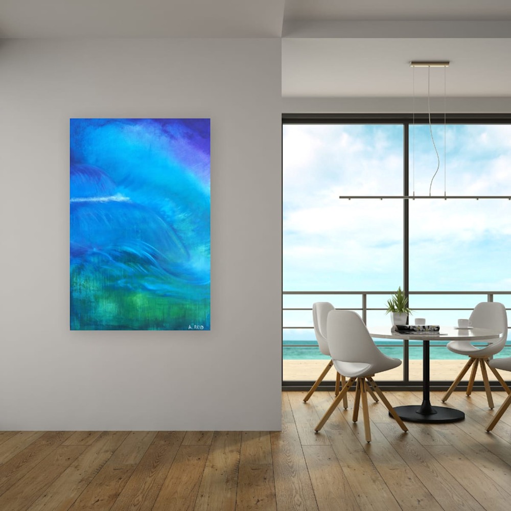 Deluge fine art print by Anne Reid Artist on a white feature wall beside an ocean-view dining nook — flowing aqua, teal, and ultramarine abstraction