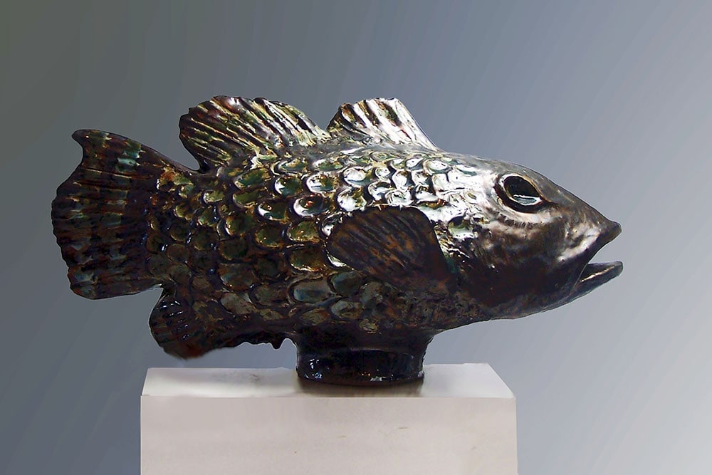 The Large Fish is the second-to-last sculpture created by Weston Neil Andersen. At the time Weston was very involved in the esoteric writings of Carlos Castenaeda. The super-size of the Carp and Weston’s ebony glaze with its glossy surface that shimmers in the light give the fish a powerful mystical presence