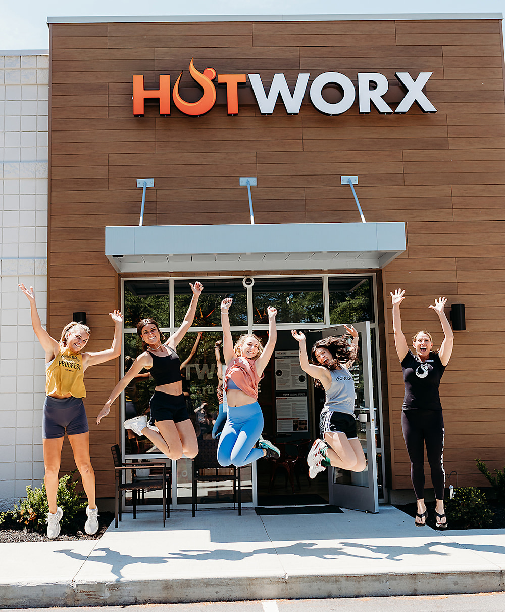 Infrared HOTWORX sauna glowing orange — a biological lightfield laboratory disguised as fitness