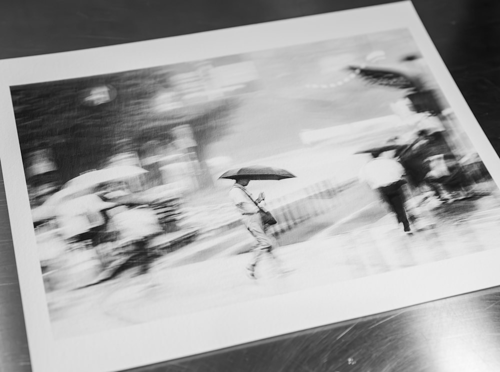 Close-up of a Kumamoto Rain Study print on textured museum-grade paper, surrounded by additional proof variations during the editing process.