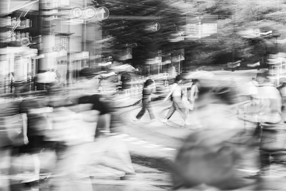 Two women walking in perfect sync through dense rainfall, surrounded by stretched and ghosted figures created by long exposure.