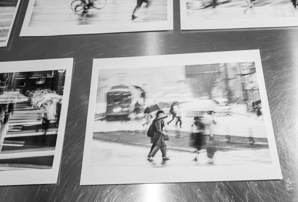 Angled view of a Kumamoto Rain Study fine art print on museum-grade paper, showing tonal detail, grain, and precision in the proofing stage.