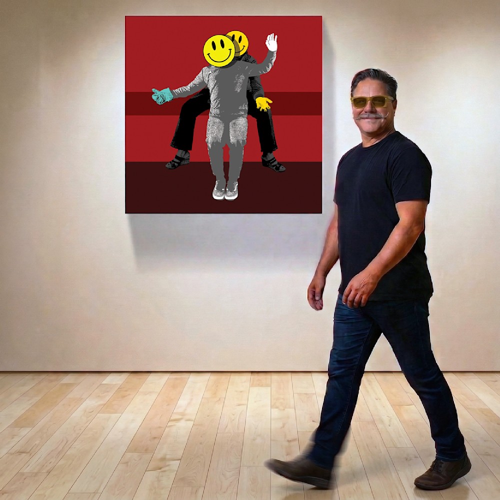 Artist Jon Savage walking past his painting 'Help Wasted' during the Neon Afterlife exhibition at OMA West in Oceanside, CA.