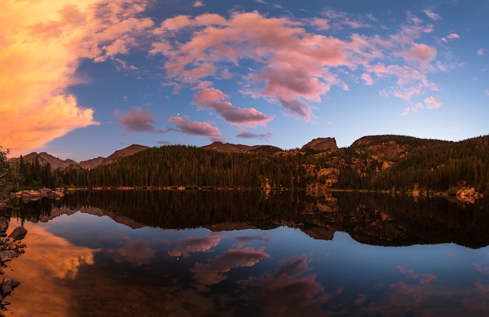 Photo of clouds curving over Bear Lake in Rocky Mountain National Park in Colorado at sunset