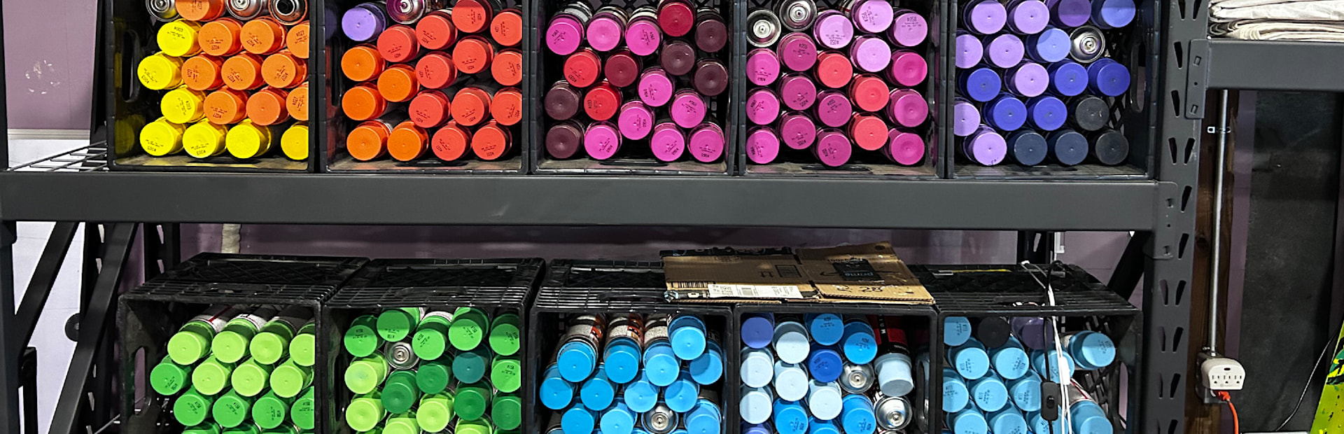 
        <div class='title'>
          Colorfule spraypaint in briteso's Tallahassee, FL studio.
        </div>
       
        <div class='description'>
          Multicolored spraypaint cans sorted into crates by color.
        </div>
      