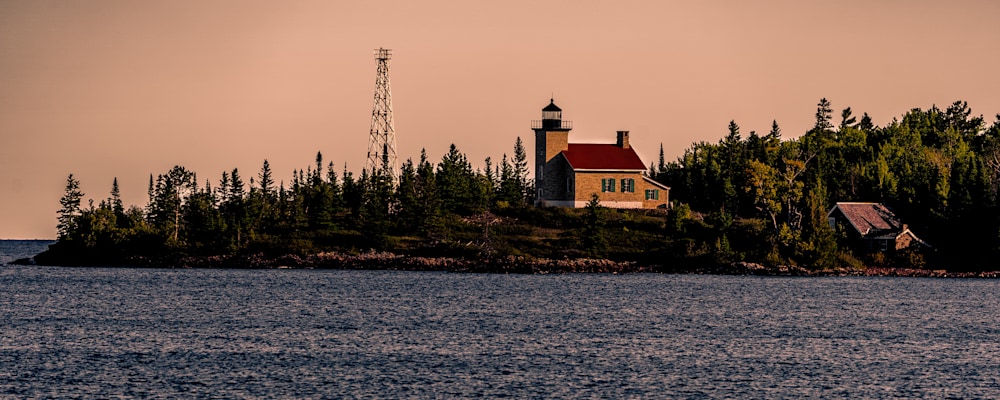 
        <div class='title'>
          Copper Harbor Lighthouse on Lake Superior
        </div>
       
        <div class='description'>
          The Copper Harbor Lighthouse is located on the tip of the Keweenaw Peninsula, and although located on a peninsula, the road is closed to the public, who can access the Lighthouse by boat. The Lighthouse is a schoolhouse-style lighthouse which went into operation in 1849, and was put on the National Register of Historic Places in 2012.
        </div>
      