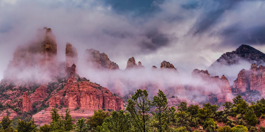 
        <div class='title'>
          Sedona's Veil slide
        </div>
       
        <div class='description'>
          Low clouds cling to the red mountain faces at sunrise in Sedona.
        </div>
      