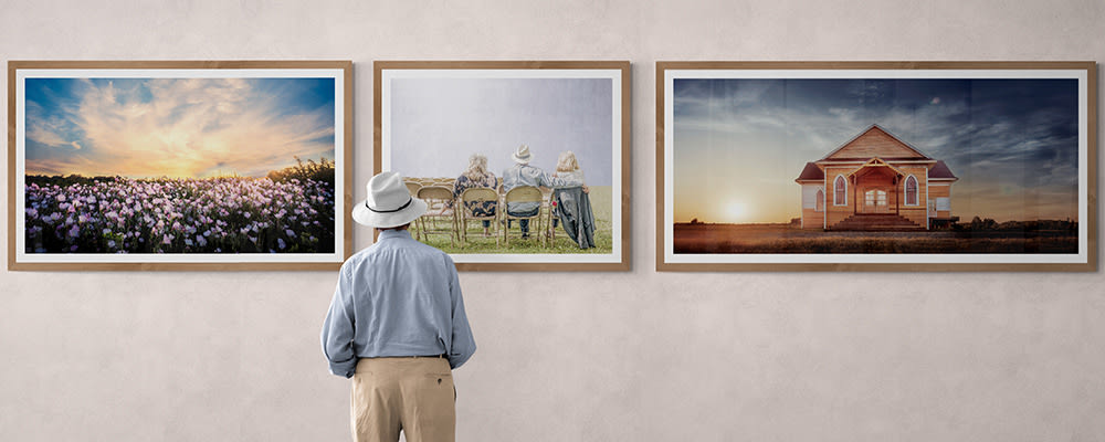 
        <div class='title'>
          man standing in front of gallery wall big1000x400
        </div>
       