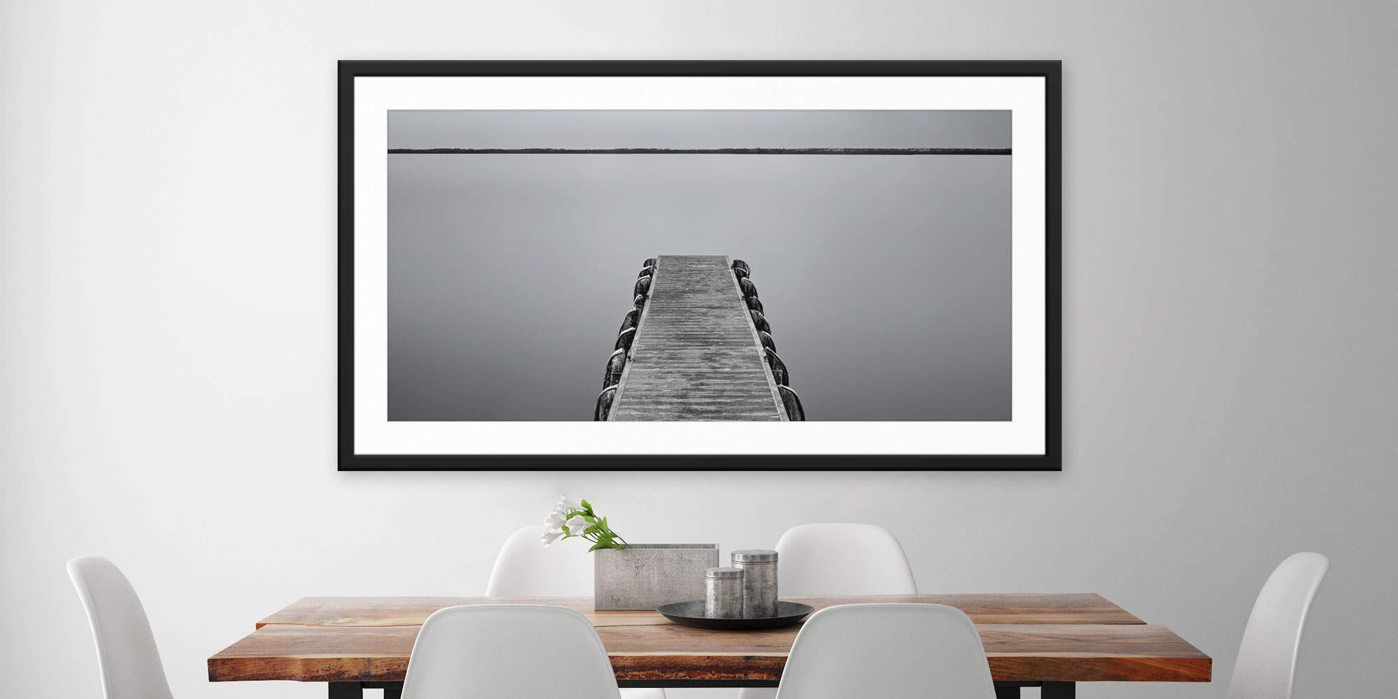 
        <div class='title'>
          Silver Safety Harbor - Safety Harbor, FL by Andrew Vernon
        </div>
       
        <div class='description'>
          A framed and matted print of Silver Safety Harbor by Andrew Vernon hangs in a modern dining room
        </div>
      