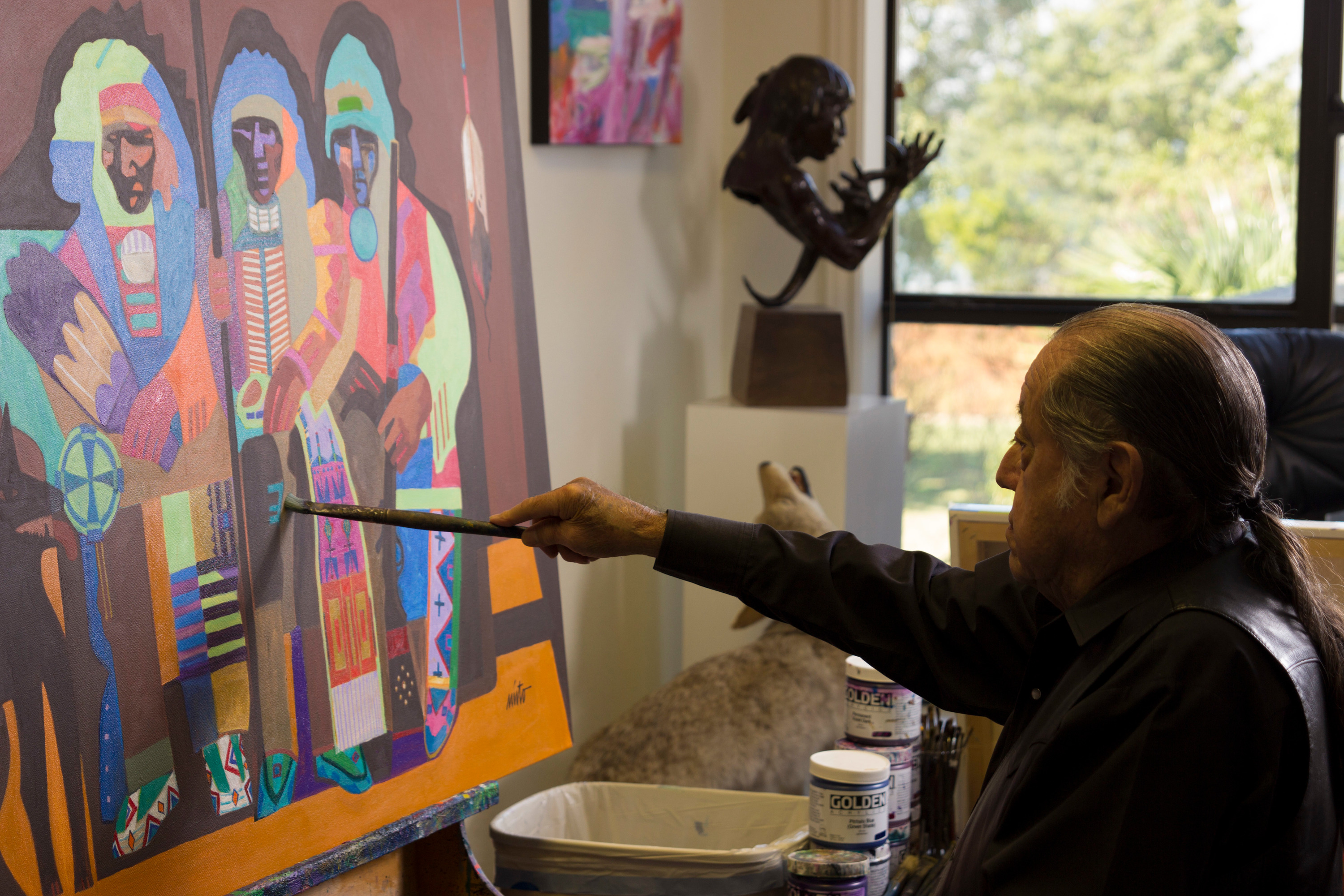 
        <div class='title'>
          John  Nieto painting, in the studio, acrylic painting, native american painting
        </div>
       
        <div class='description'>
          John Nieto painting in his studio
        </div>
      