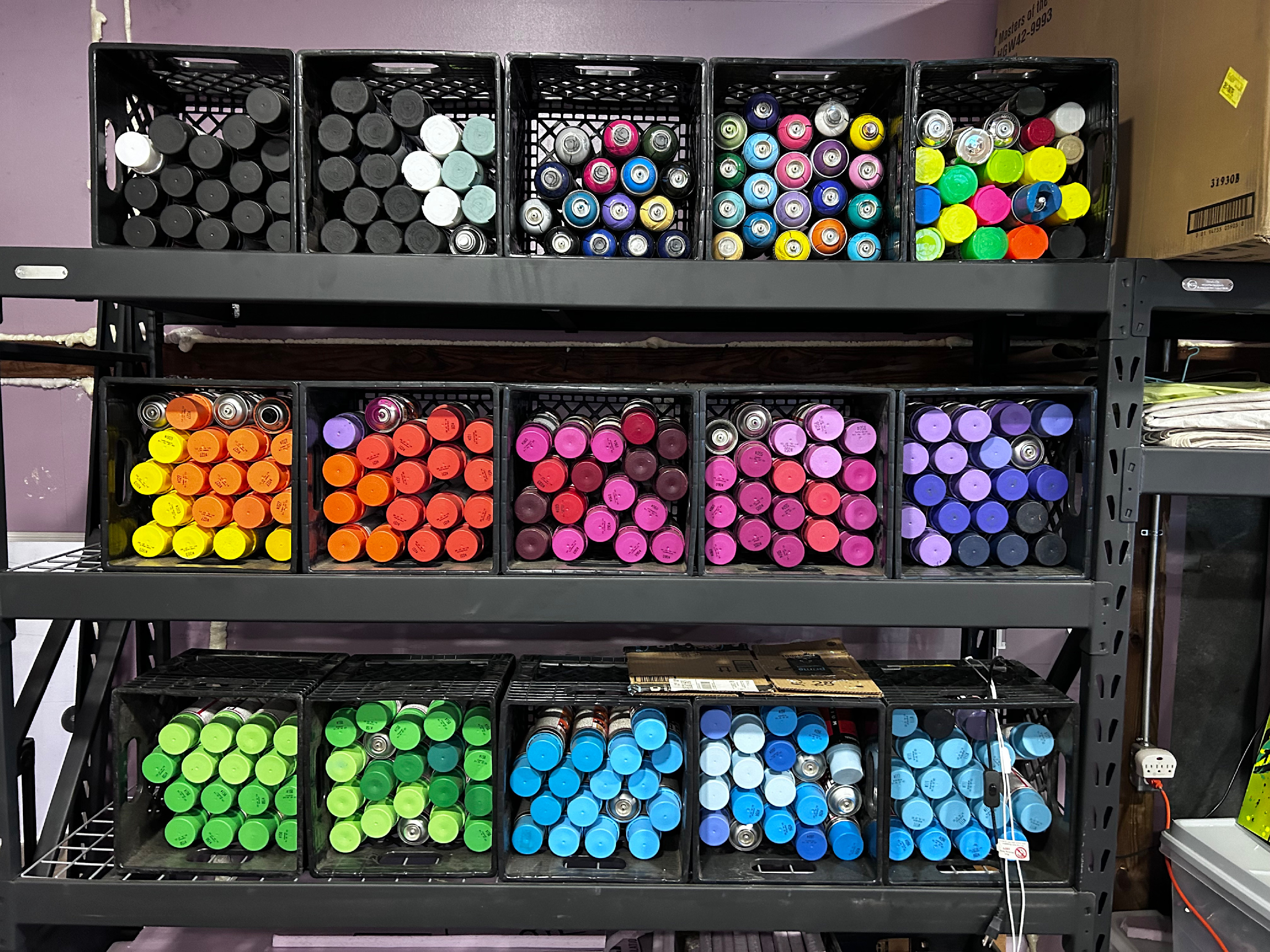 
        <div class='title'>
          Colorfule spraypaint in briteso's Tallahassee, FL studio.
        </div>
       
        <div class='description'>
          Multicolored spraypaint cans sorted into crates by color.
        </div>
      