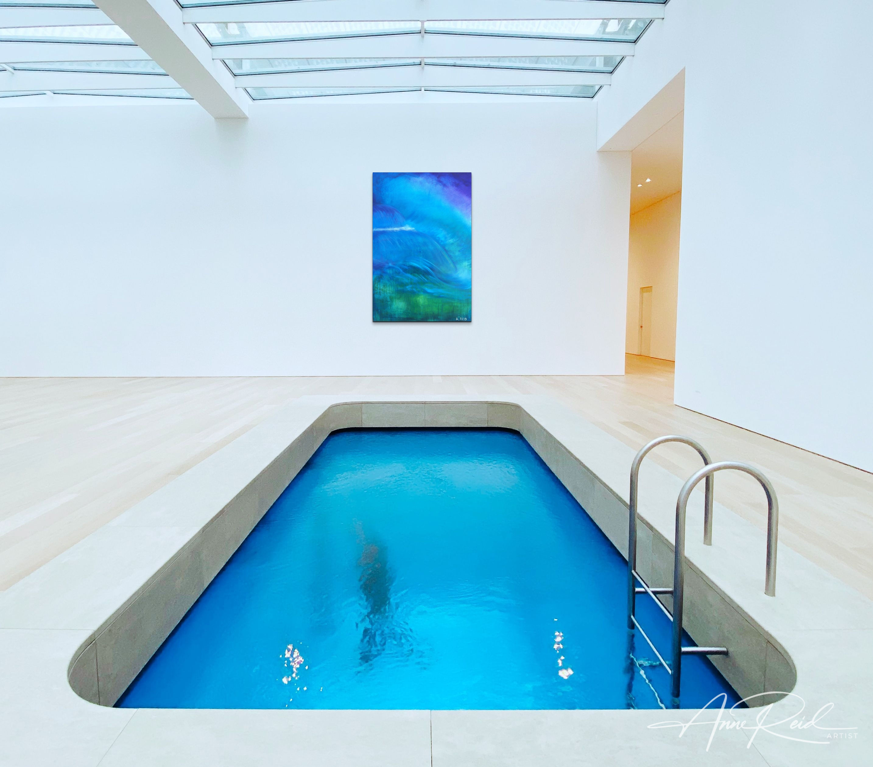 Deluge print presented in a skylit indoor pool gallery—clean architecture and luminous read at distance