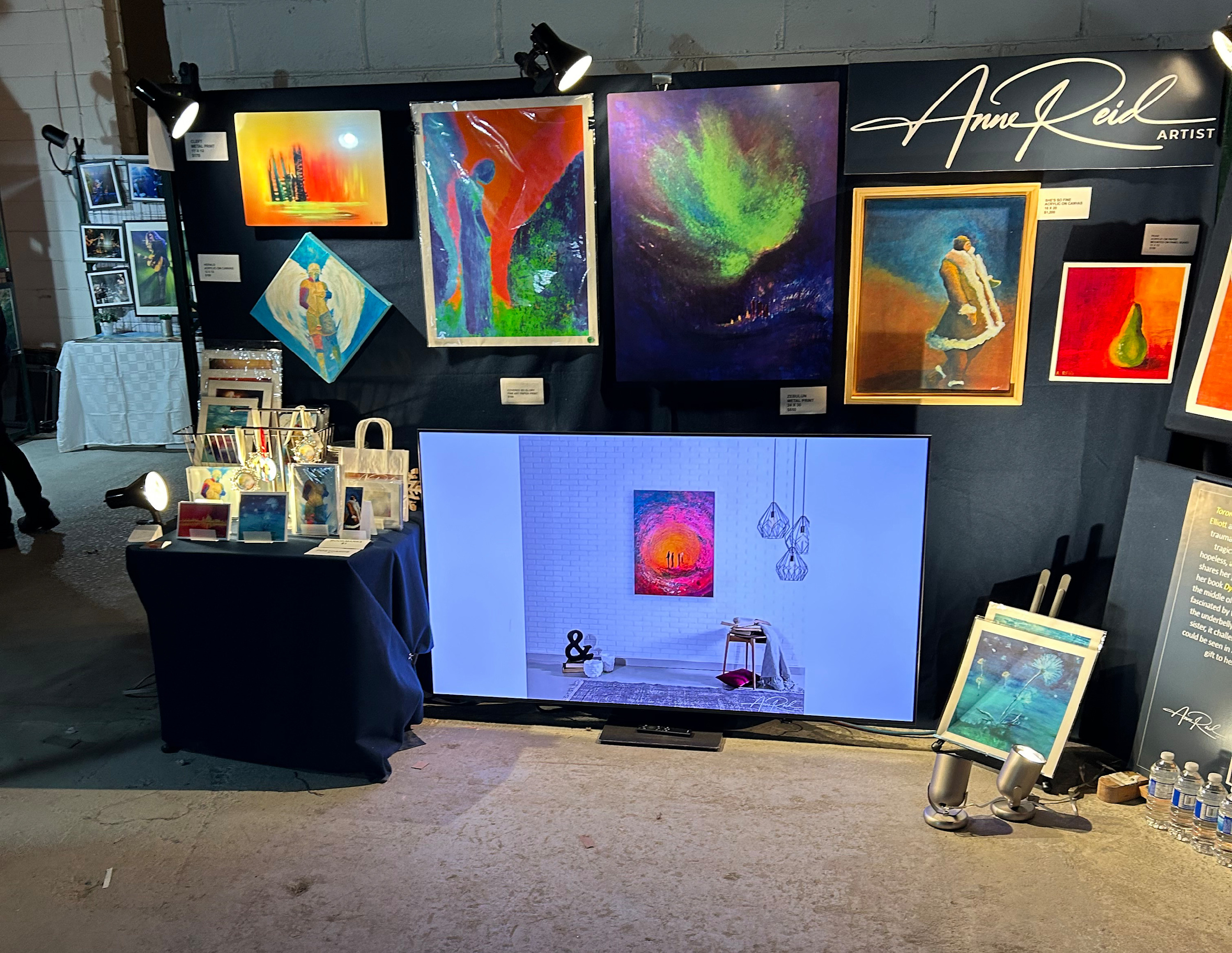 RAW Toronto Artshow booth variation showing additional works and display screen
