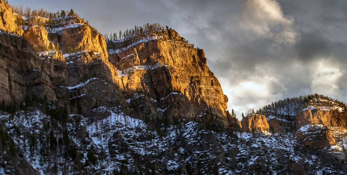 
        <div class='title'>
          Sunlit Mountain Tops in Colorado
        </div>
       
        <div class='description'>
          Driving through the beautiful Glenwood Canyon in Colorado at sunset
        </div>
      