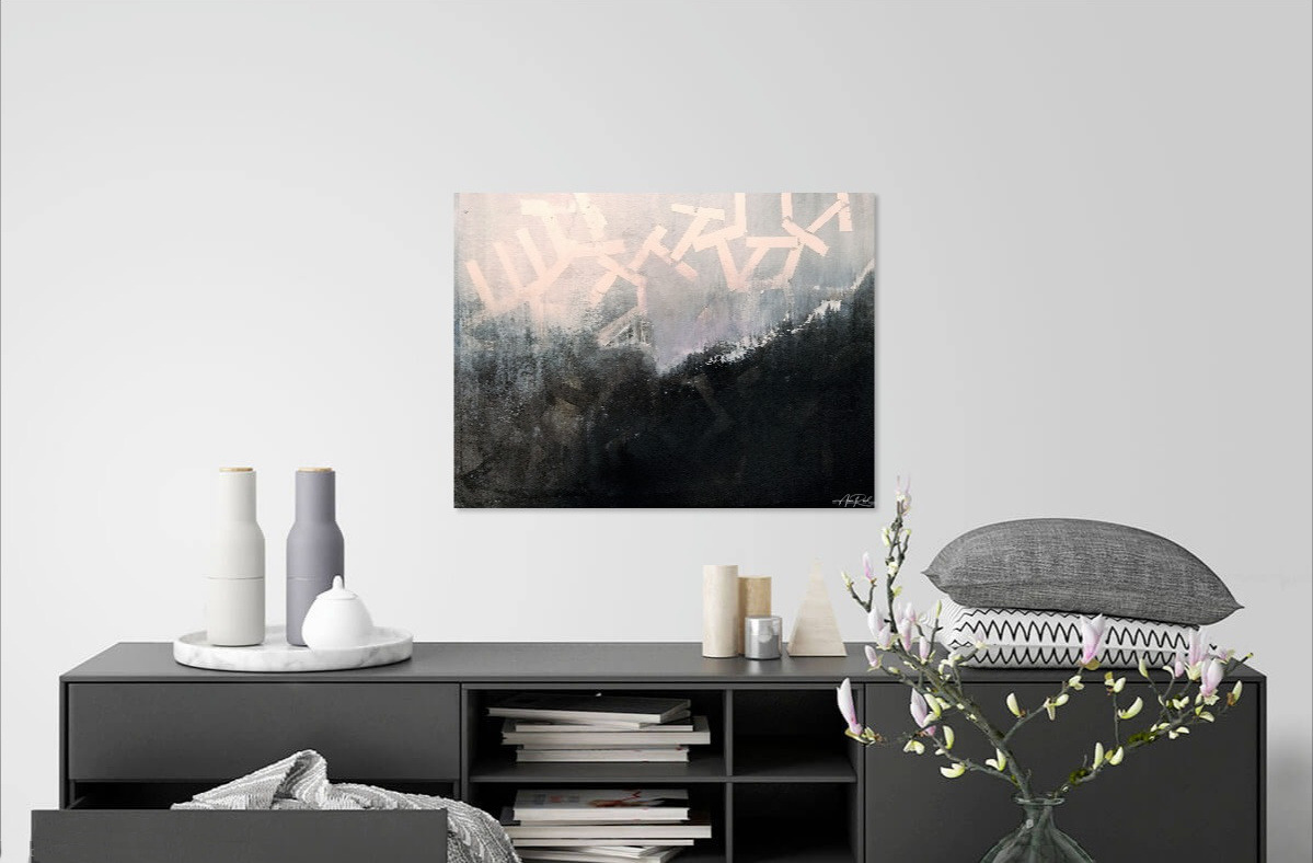 Captivity abstract painting hung above sleek dark console with ceramics and branches in bright living room
